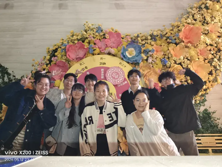 Ren Protein Design Group: A group photo by the floral display